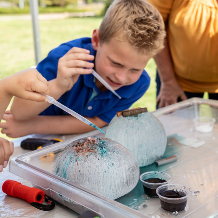 Boy Making Art With An Eye Dropper And Dye