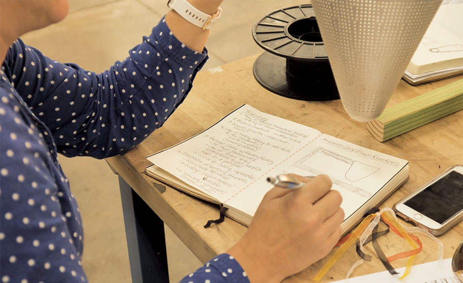 Person Writing In Their Journal