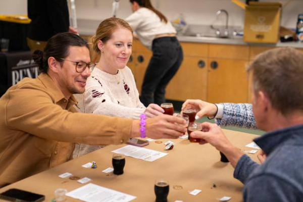 A Group Of Friends With Beers Toasting Each Other