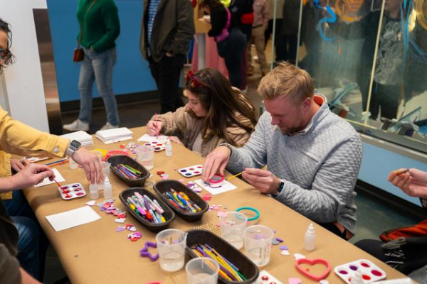 Group of Adults Making A Painting Together