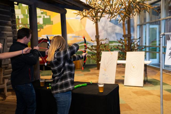 Two Adults Playing Archery Game Together