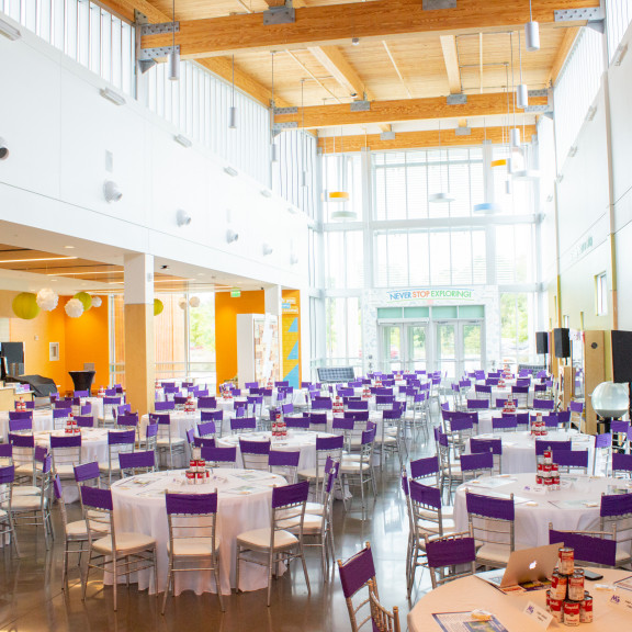 Amazeum Lobby Set Up With Tables For An Event