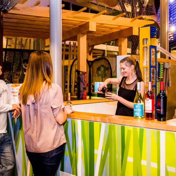 Bartender Pouring Drink For Guest At Event