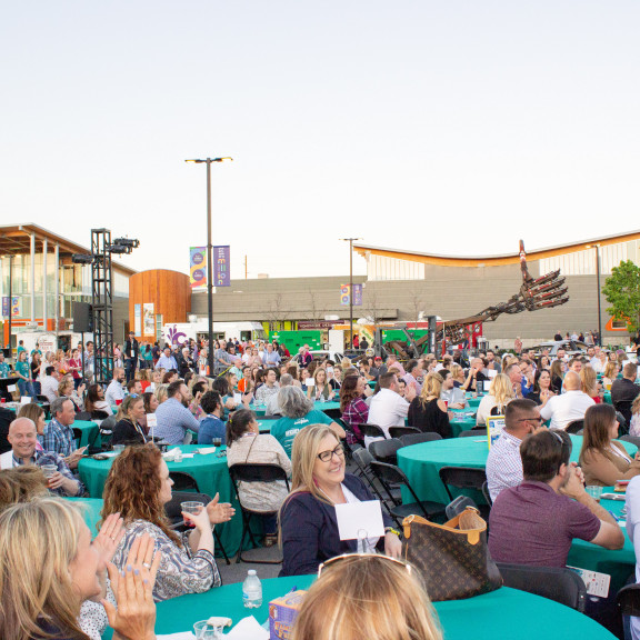 Wide Shot Of Large Outdoor Event With Tables