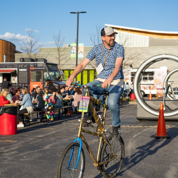 Man Riding On Custom Bike Thats Extremely Tall