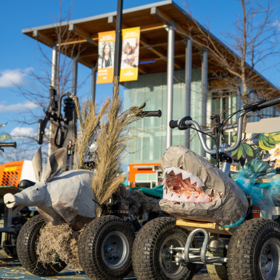 Silly Shark And Armadillo 4 Wheelers In Front of Amazeum