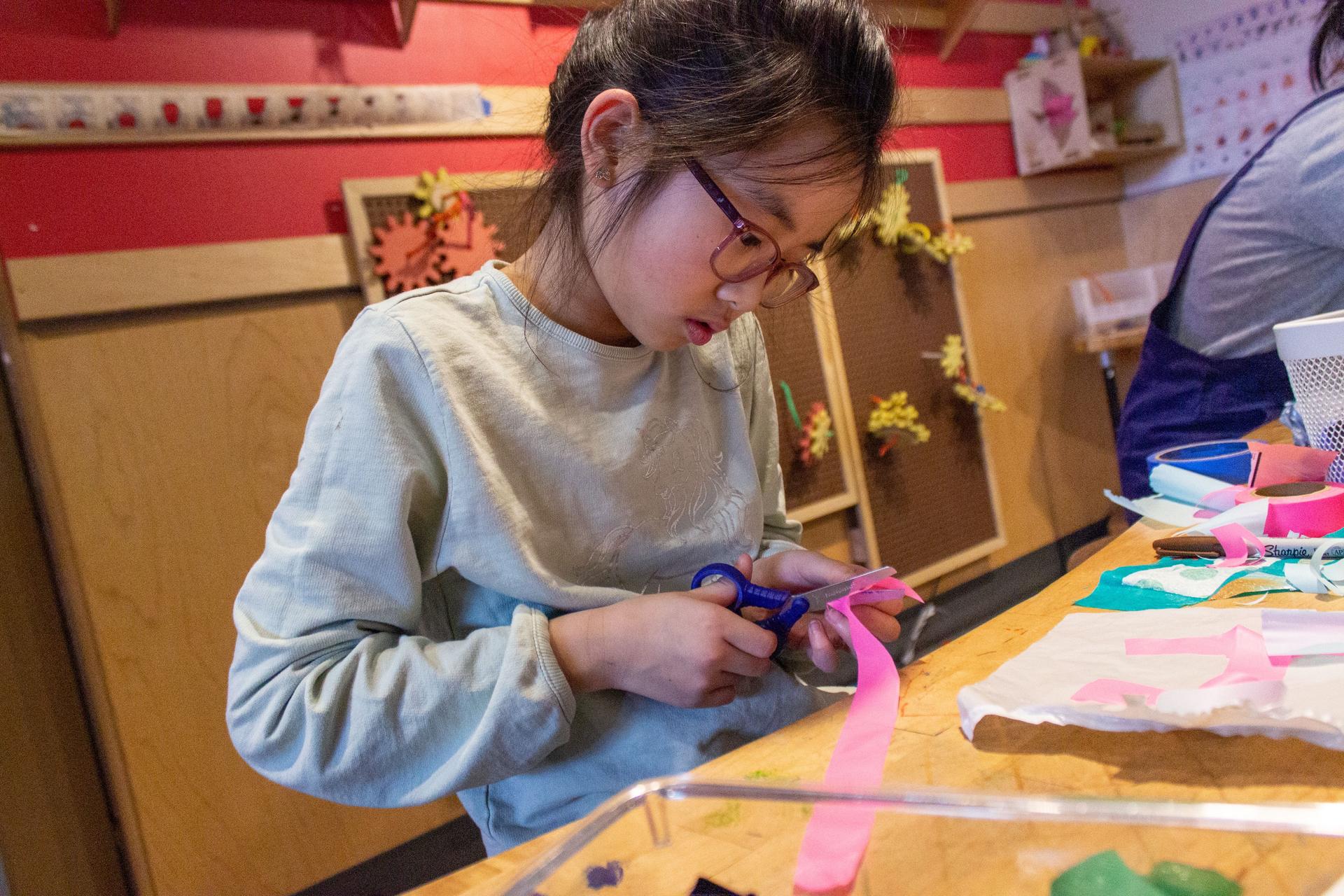 Girl Cutting Ribbon In Tinkering Hub