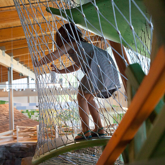 Girl Playing With Nets Of Canopy Climber