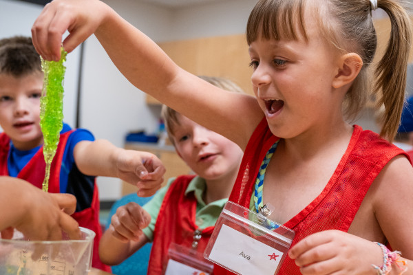 Girl Playing With Slime at Summer Camp