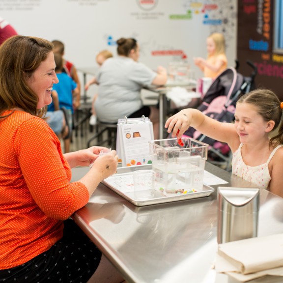 Mom And Daughter Seeing If Jelly Beans Will Float