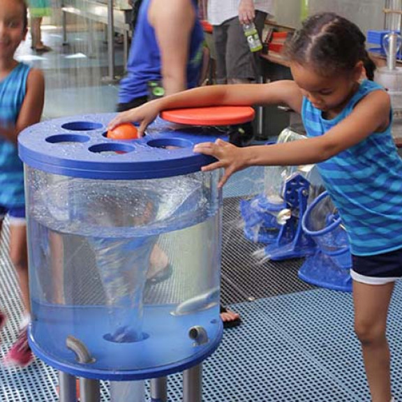 Girl Interacting With Whirlpool Exhibit