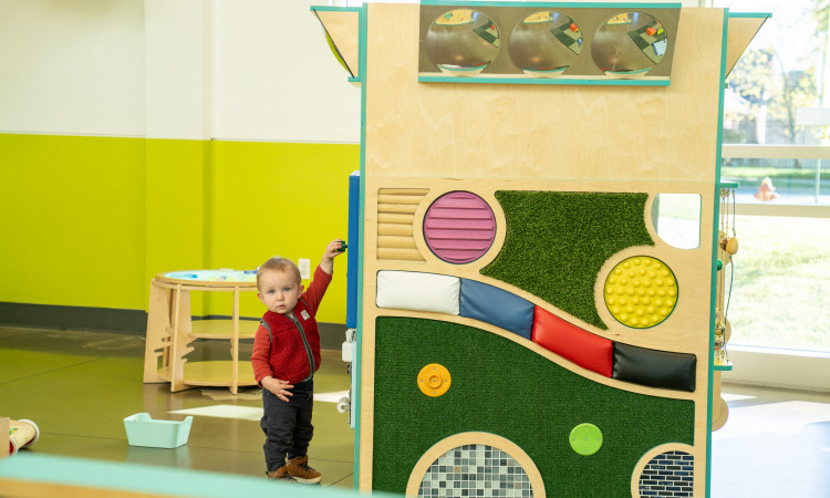 Young Boy Playing With Studio Grow Exhibit