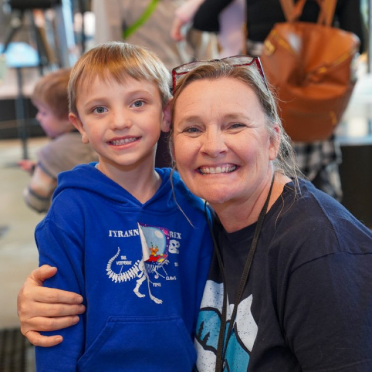 Helper Posing With Young Guest