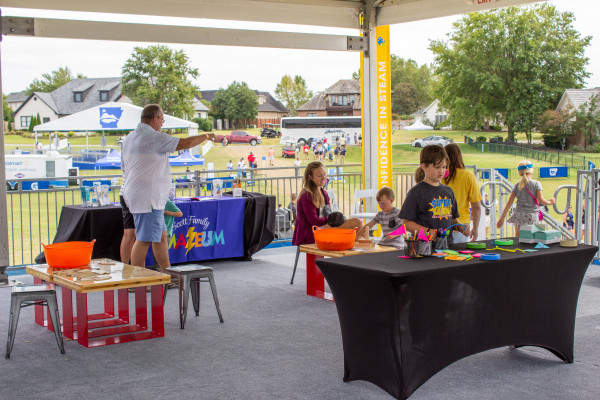 Children Visiting Exhibit Tables Set Up Outside