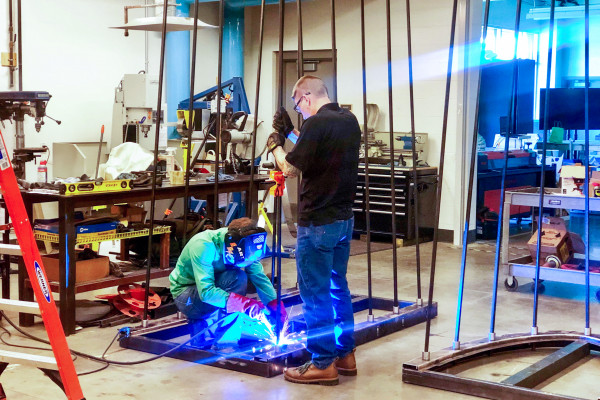 Two Makers Welding Metal For a Project