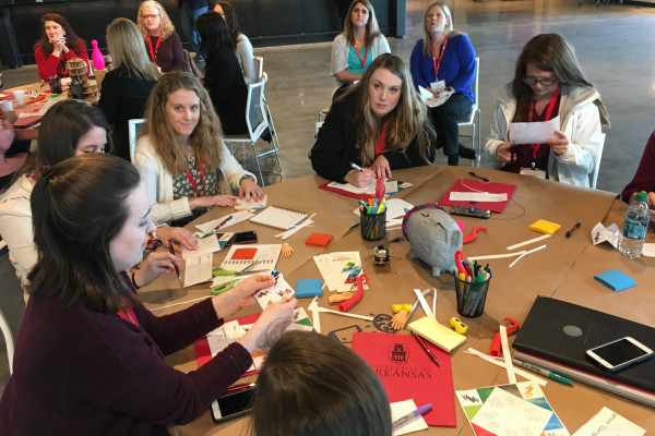 Group Of Women Paper Crafting At A Table