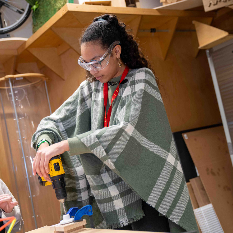 Person Using A Power Drill For Their Project