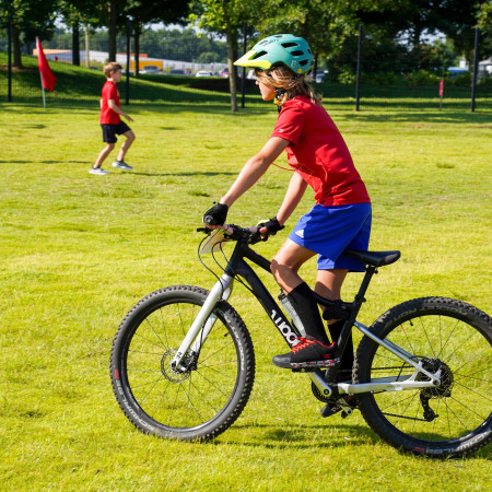 Boy With Red Shirt Riding Bike Outside Amazeum