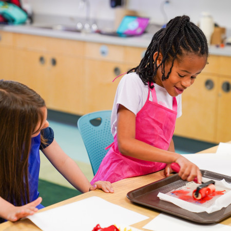 Girl Working With Paint Roller For Gelatin Project