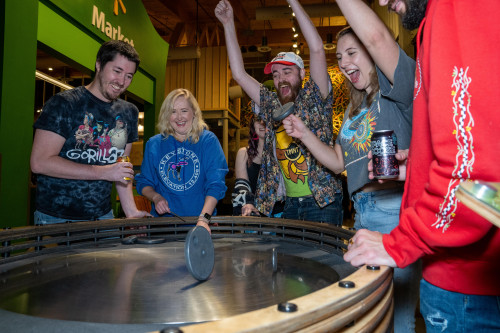 Adults With Drinks Enjoying Exhibit