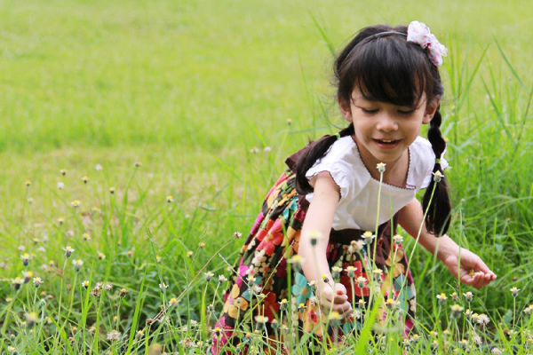 Homeschool Student Playing In Grass