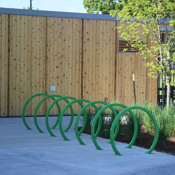 Image Of Green Bicycle Rack Outside Amazeum